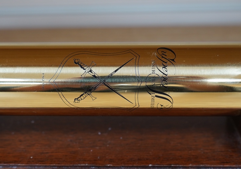 A reproduction 19th century style brass kaleidoscope by Culpeper Instruments, on a wooden stand, 33.5cm long, together with a wood cased brass solitaire set, 10.5cm diameter. Condition - fair to good.